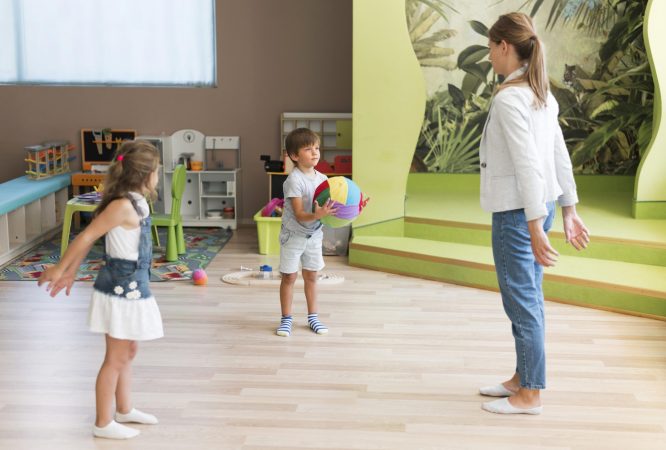 full-shot-teacher-kids-playing-with-ball